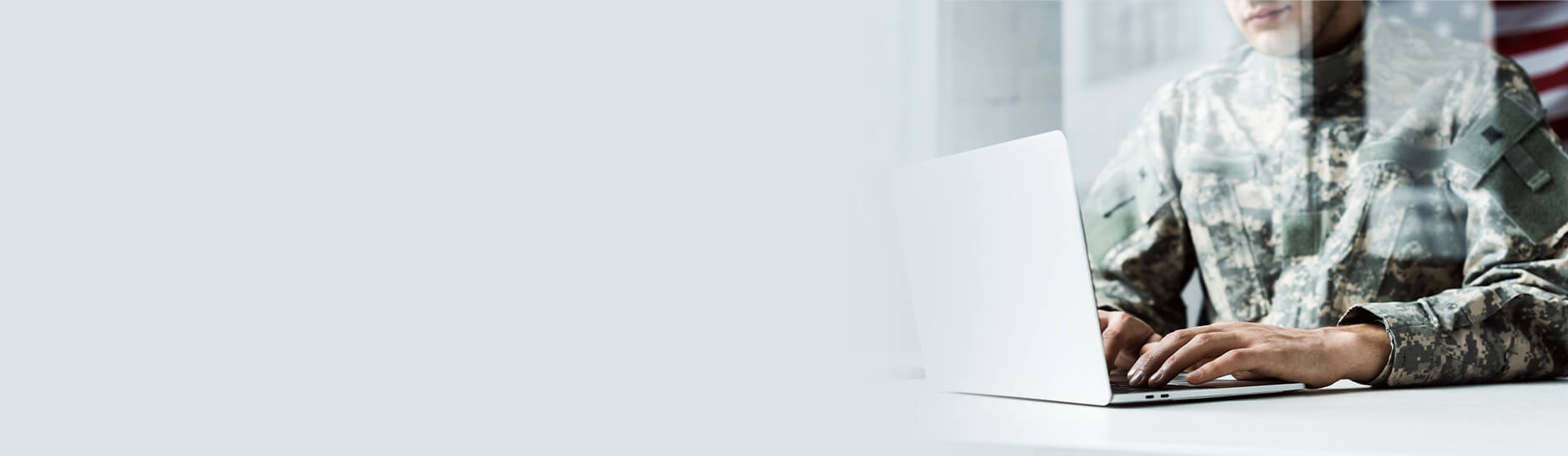 One Military person sitting and working in the laptop