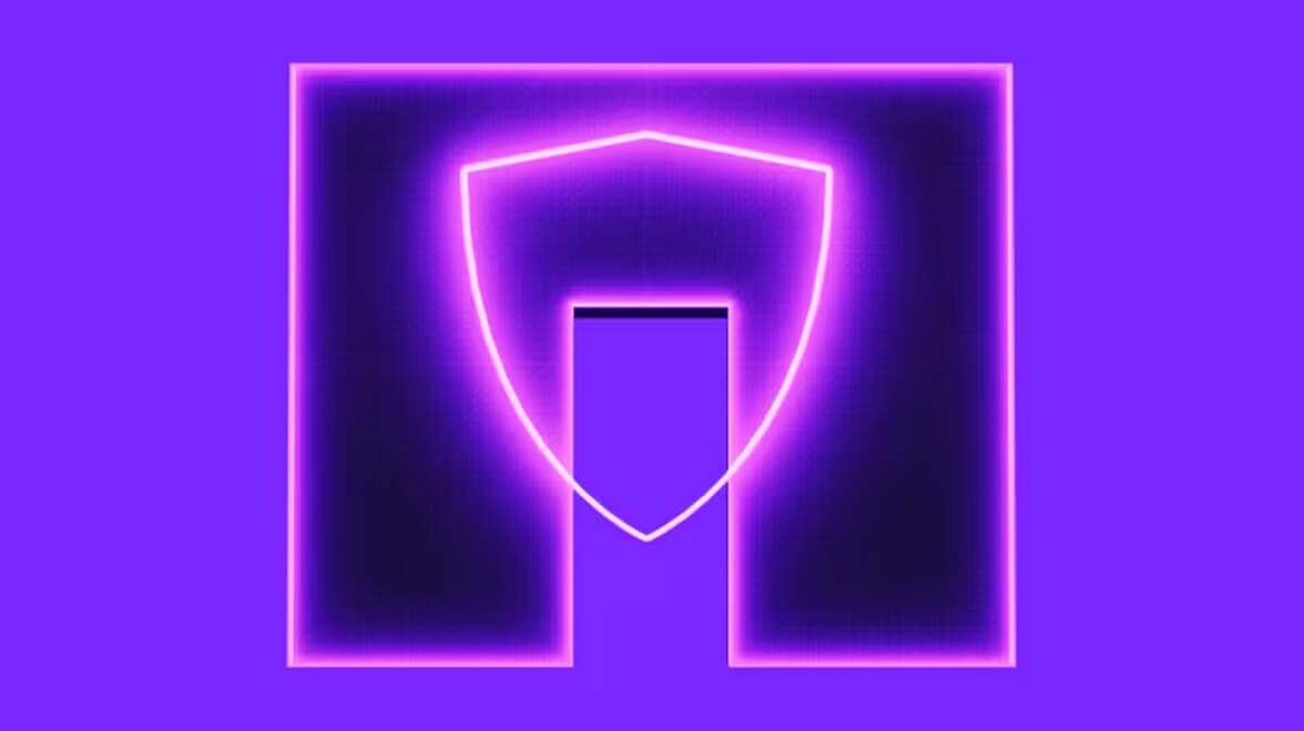 Gráfico de escudo digital iluminado con neón que representa la ciberseguridad y la protección de datos.