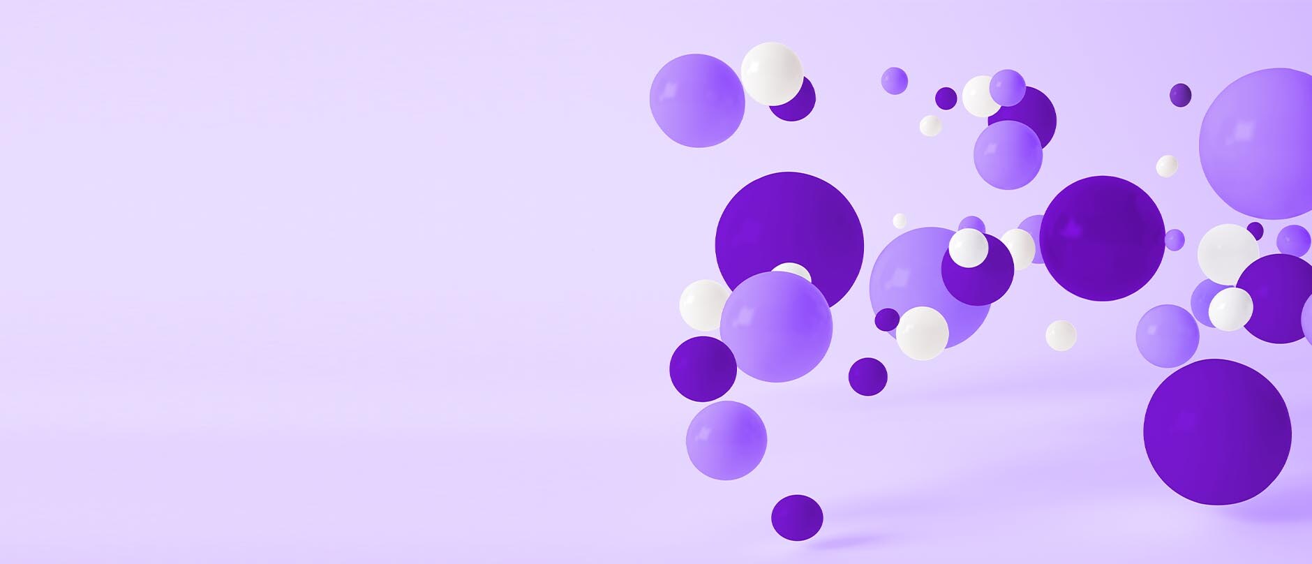 White and purple spheres floating on a purple background 