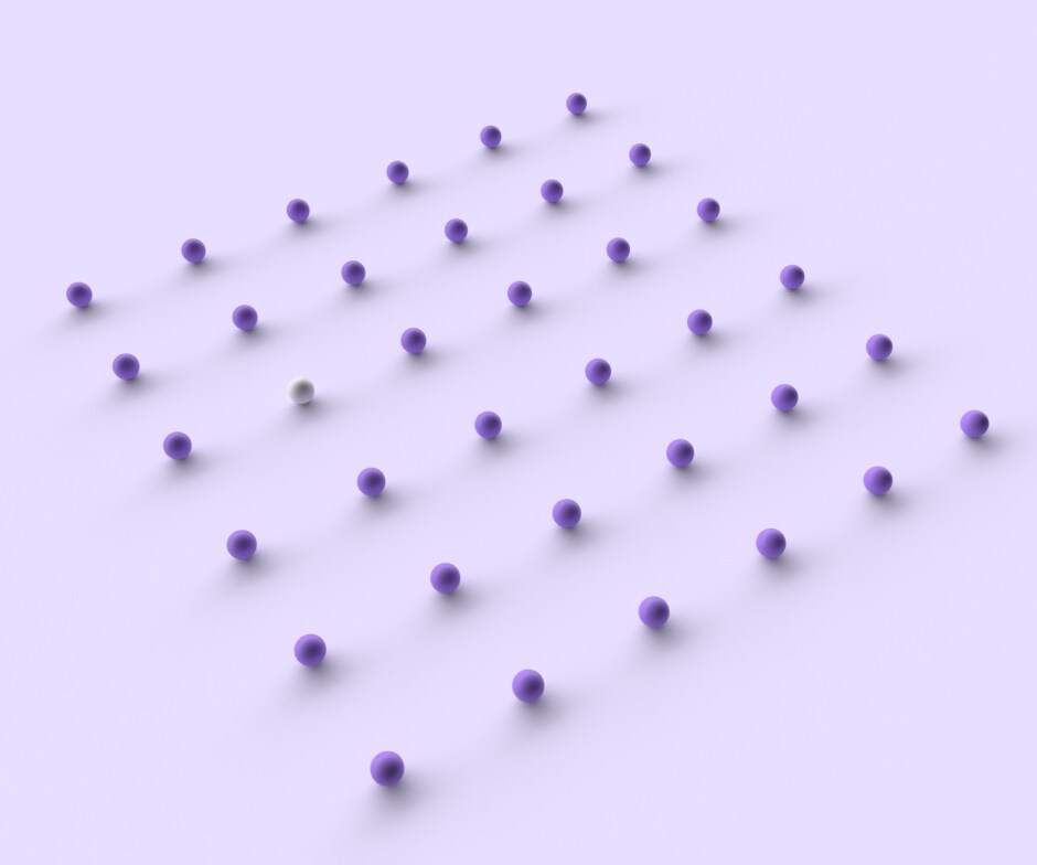 Palline viola con una pallina bianca su sfondo viola