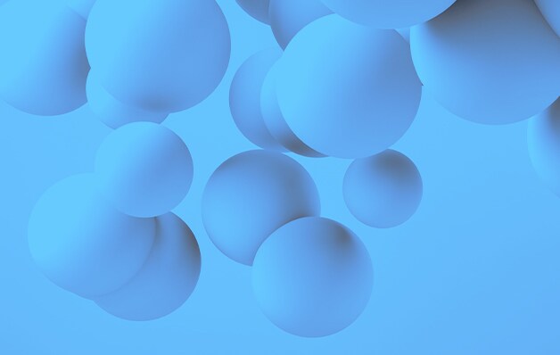 抽象的な青色の環境下で浮かんでいる青色のボール