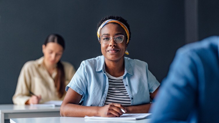 Posing to camera while writing an exam