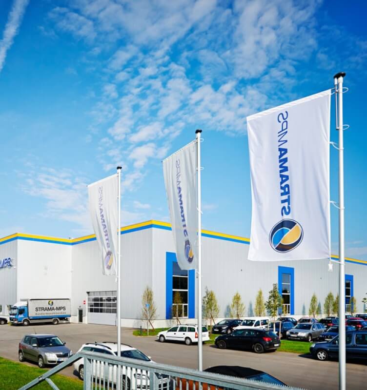 Branded flags outside a STRAMA facility