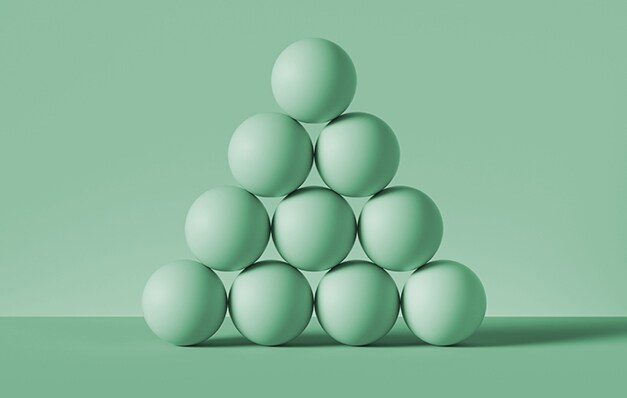 green balls stacked like pyramid
