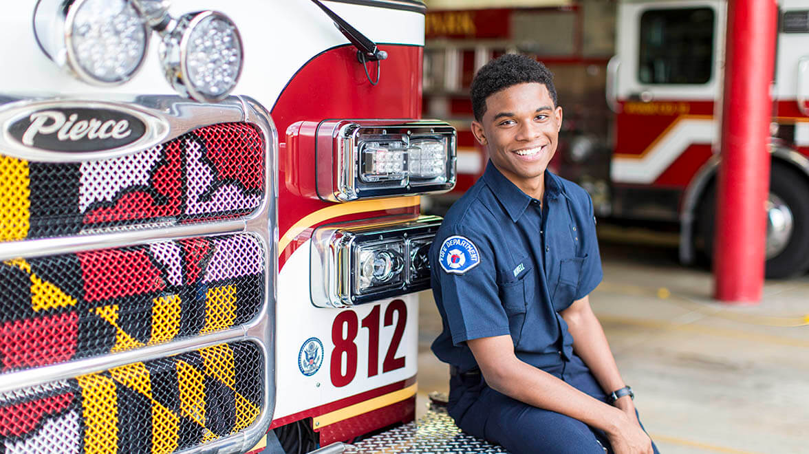 Firefighter sitting on fire truck