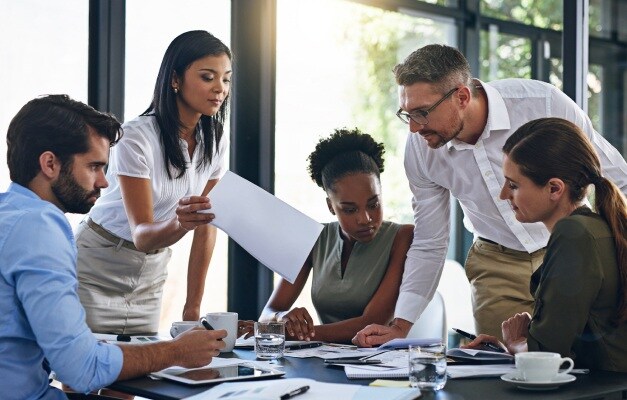 five people at a work meeting