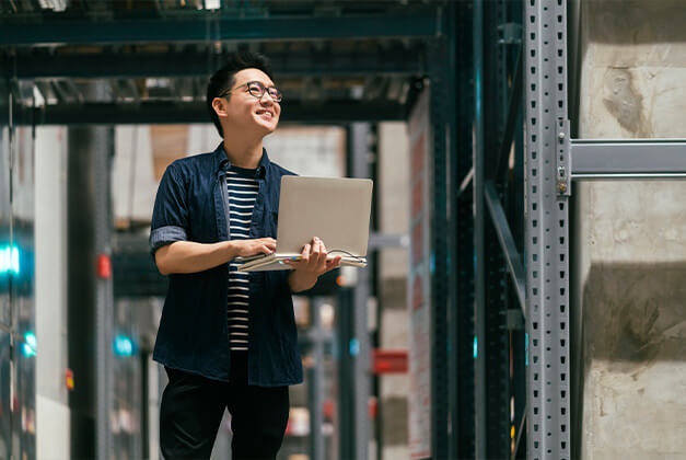 Smiling engineer satisfied with affordable AFF A-Series enterprise flash