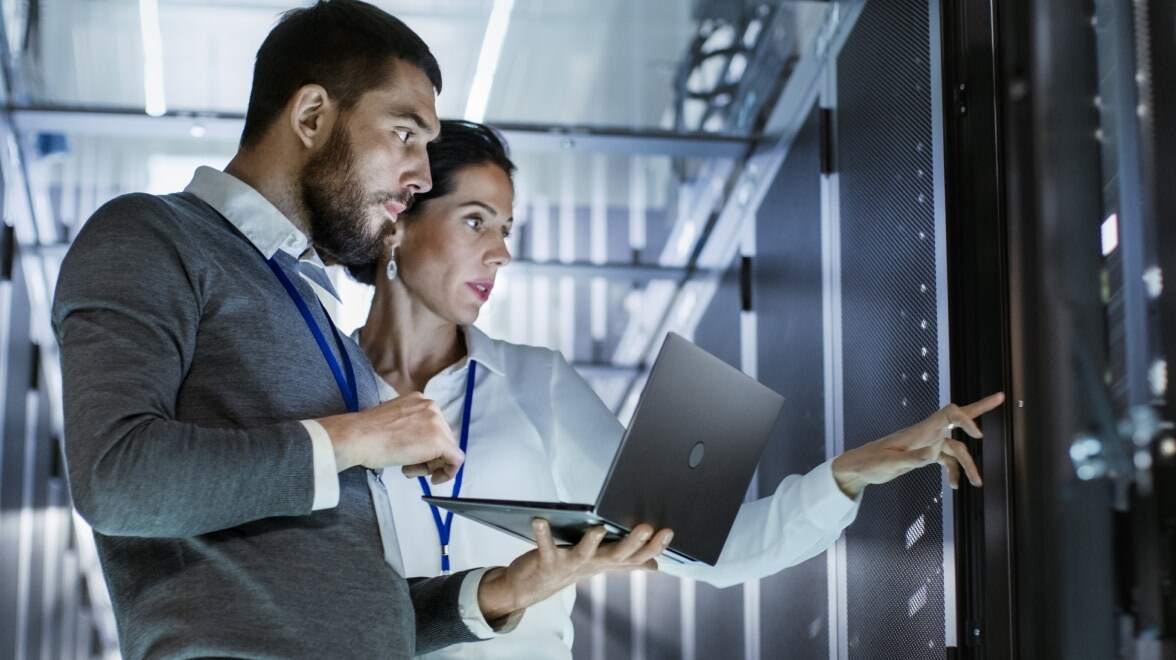 two people in a server room