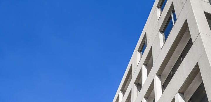view of a building and sky from the bottom of the building