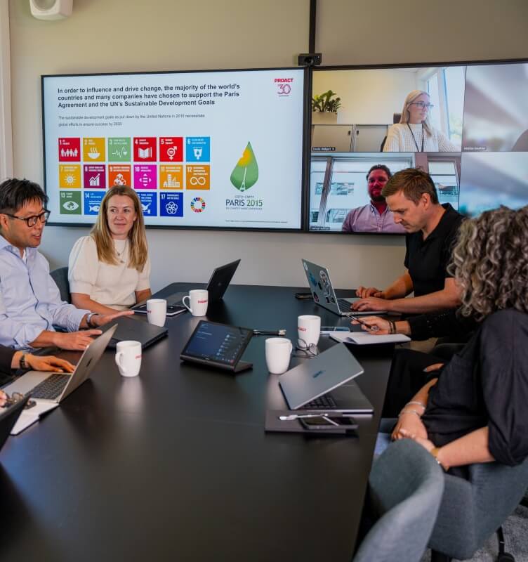 Four colleagues in a conference room