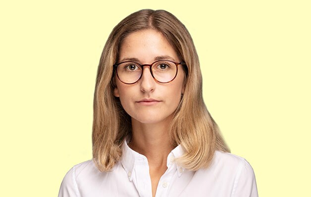 girl with glasses on yellow background