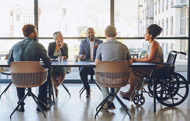 Group of people chatting in office room