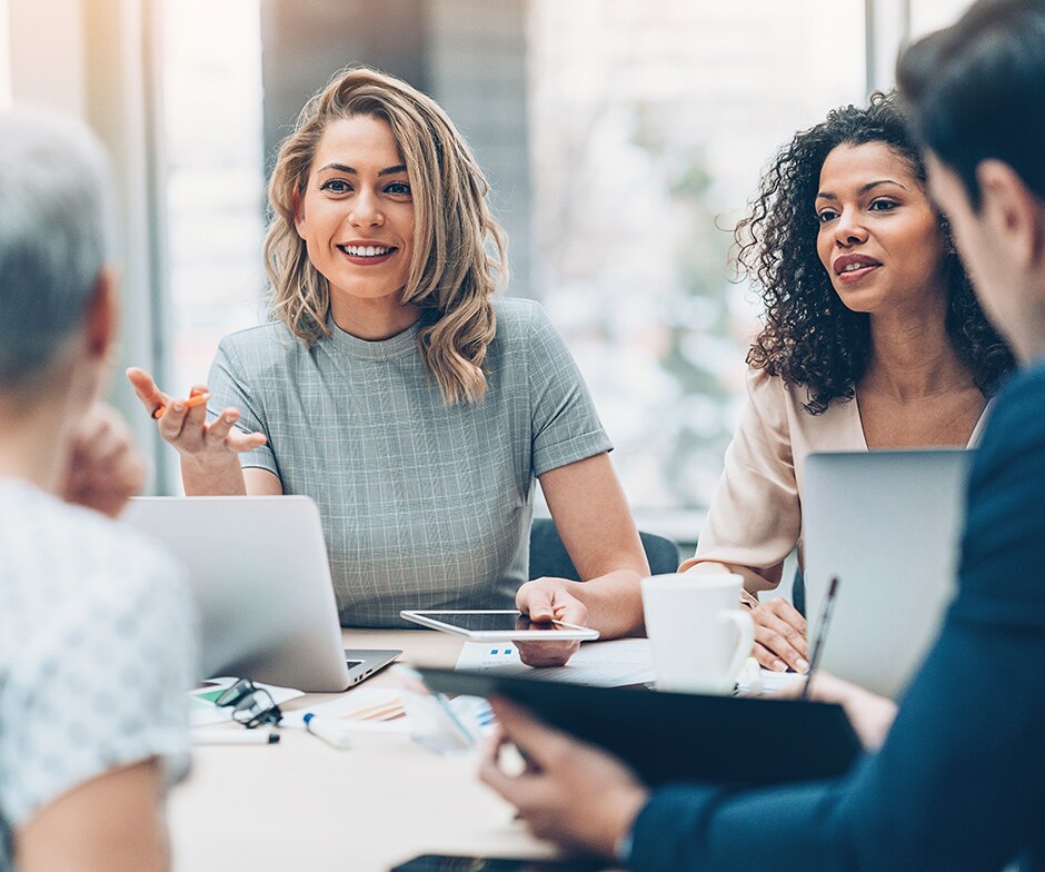 people having a round-table meeting
